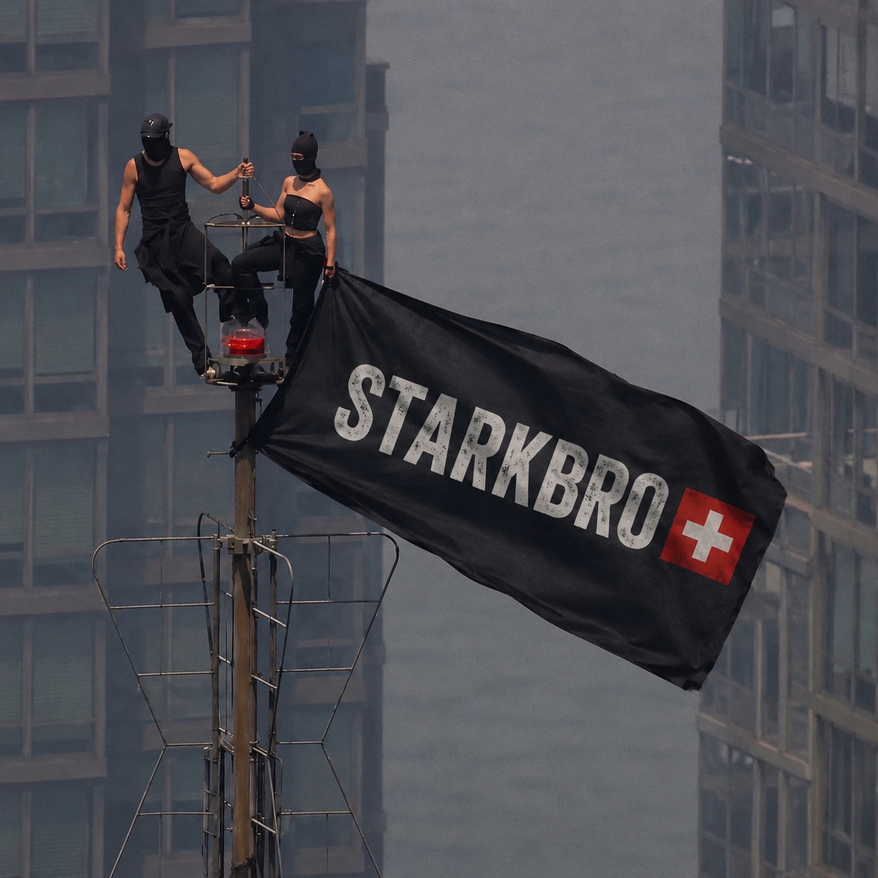 Two people on top of a city mast raising a black STARKBRO flag with a Swiss cross